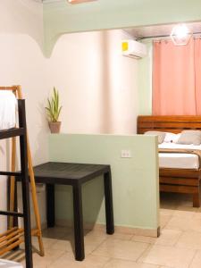 Postel nebo postele na pokoji v ubytování Hostal Síndigo