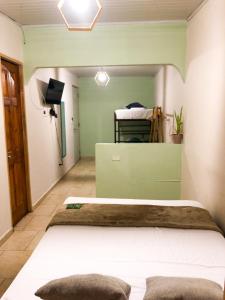 Postel nebo postele na pokoji v ubytování Hostal Síndigo