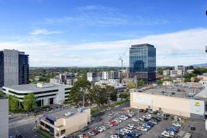 an aerial view of a city with a parking lot at Lux 1 bedroom Executive Apt in Box Hill in Box Hill +7 photos