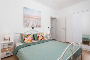 a bedroom with a bed and a painting on the wall at Holiday home in Slivnica - Paklenica Riviera 44875 in Slivnica +24 photos