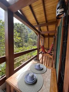 Posezení v ubytování Jardim Secreto Chalé Azaléia