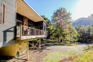 a balcony on the side of a house at Hygge in Harrietville