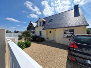 a house with a car parked in front of it at Modern House in Brittany near La Baule Bay in Pénestin