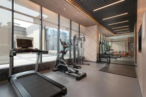 a gym with two treadmills and a treadmill at Holiday Inn Express Xi'an Daxing by IHG in Xi'an