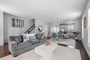 a living room with a couch and a table at Downtown Richmond, Cozy 3BR, Near VCU in Richmond