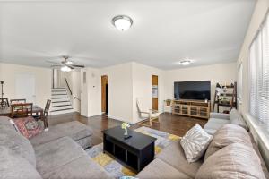 a living room with a couch and a table at Cozy 3BR, Near NYC, Cruise Port,Statue of Liberty, Free Driveway Parking in Bayonne