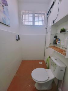 a small bathroom with a toilet and a window at Homestay DAR AL - JUFRY in Kuantan +61 photos