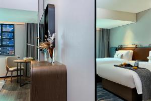 Postel nebo postele na pokoji v ubytování Echarm Hotel Guangzhou Dongpu Financial City Pazhou Convention Center - Free shuttle bus for Canton Fair