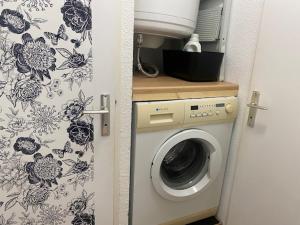 a washer and dryer in a small room at Saint-Pierre-La-Mer : Appart T2 avec Piscine, Parking, Clim, Terrasse - 4 Pers. - FR-1-795-26 in Fleury