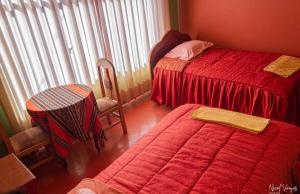 Katil atau katil-katil dalam bilik di Olas del Titicaca Backpackers Hostel