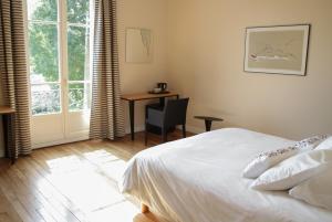 Ένα ή περισσότερα κρεβάτια σε δωμάτιο στο Maison M Troyes