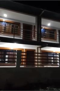 a blurry picture of a building with a balcony at Pacifico's Hostel in Barili