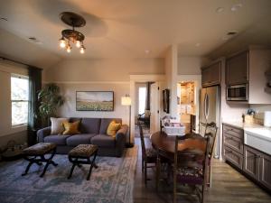 a living room with a couch and a table at RedTail Inn - 3 Suites Sleeps up to 12 in Ashland