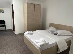 Postel nebo postele na pokoji v ubytování Resort SPA Clisura Dunarii + 20 fotografií