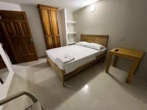 Postel nebo postele na pokoji v ubytování ApartaHotel Los Naranjos