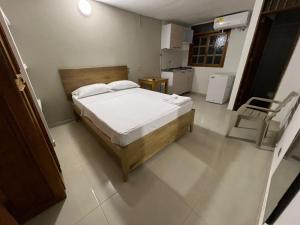 Postel nebo postele na pokoji v ubytování ApartaHotel Los Naranjos