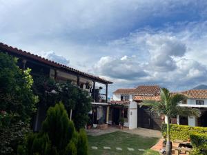 a view of a house with a yard at Casa Boyero de Berna Campestre in Villa de Leyva