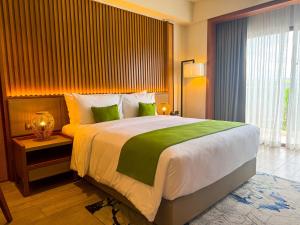 Voodi või voodid majutusasutuse Cebu One Tectona Resort Hotel toas
