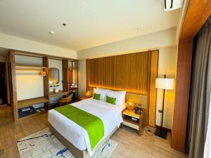 Voodi või voodid majutusasutuse Cebu One Tectona Resort Hotel toas