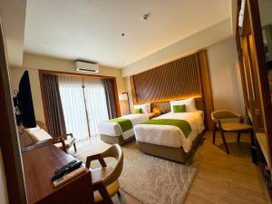 Voodi või voodid majutusasutuse Cebu One Tectona Resort Hotel toas