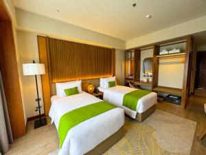 Voodi või voodid majutusasutuse Cebu One Tectona Resort Hotel toas