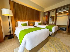 Voodi või voodid majutusasutuse Cebu One Tectona Resort Hotel toas