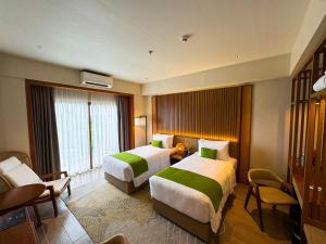 Voodi või voodid majutusasutuse Cebu One Tectona Resort Hotel toas