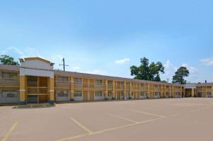 an empty parking lot in front of a building at Americas Best Value Inn Alexandria in Alexandria