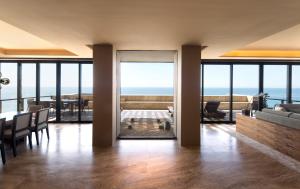 a living room with a view of the ocean at JW Marriott Los Cabos Beach Resort & Spa in San Jos&eacute; del Cabo
