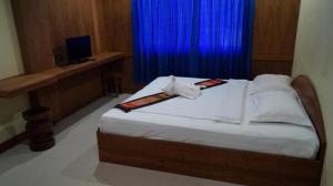 Postel nebo postele na pokoji v ubytování Lankham Hotel