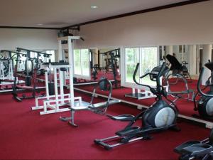 a gym with several treadmills and exercise bikes at Daosavanh Resort & Spa Hotel in Savannakhet