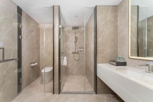 a bathroom with a shower and a sink at Holiday Inn Express Xi'an Daxing by IHG in Xi'an