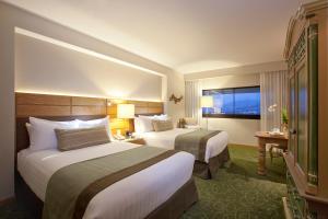 Postel nebo postele na pokoji v ubytování Marriott Tuxtla Gutierrez Hotel