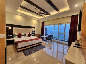 a bedroom with a bed and a view of the ocean at Wonder Hill Kasauli in Kasauli