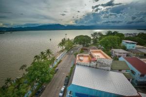 an aerial view of a town next to a body of water at Phuglong Hotel in Phayao