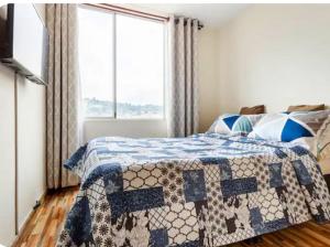 Voodi või voodid majutusasutuse AlohaT Habitaciones toas