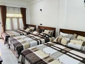 Postel nebo postele na pokoji v ubytování Sea Zone Hotel Nilaveli