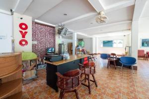 a room with chairs and a bar in a room at Alysia Spring Resort in Ko Chang