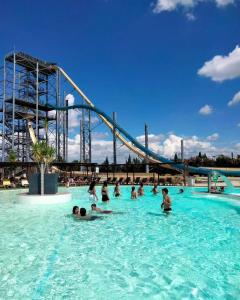 a group of people in the water at a water park at Harmonie in Monteux