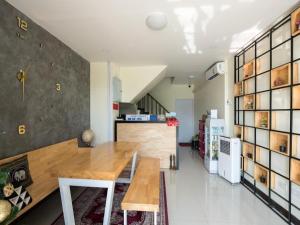a dining room with a wooden table in a store at 5 Diamond in Bangkok