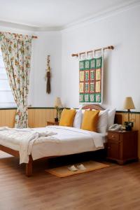 Postel nebo postele na pokoji v ubytování The Gordon House Hotel, Colaba