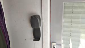 a remote control on the door of a room at BoerenBuiten De Brakke 1 in Vorstenbosch
