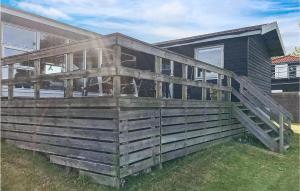 a large deck on the side of a house at Holiday Home Kokhaven in Nordenhuse