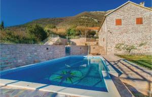 a swimming pool in the backyard of a house at 3 Bedroom Beautiful Home In Tivat in Tivat +15 photos