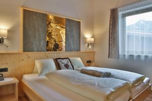 Postel nebo postele na pokoji v ubytování Haus Hintertux