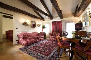 a living room with a couch and a table at Torre Dell'Orologio Signature Residence in Venice