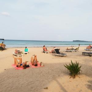a group of people laying on the beach at Surf reef beach in Trincomalee