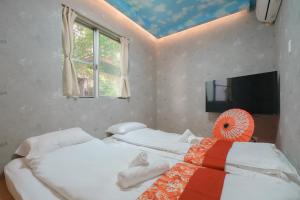 Postel nebo postele na pokoji v ubytování OHAYO Hotel 大森西