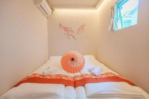 Postel nebo postele na pokoji v ubytování OHAYO Hotel 大森西