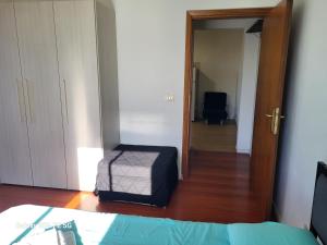 A bed or beds in a room at appartamento incantevole con parcheggio